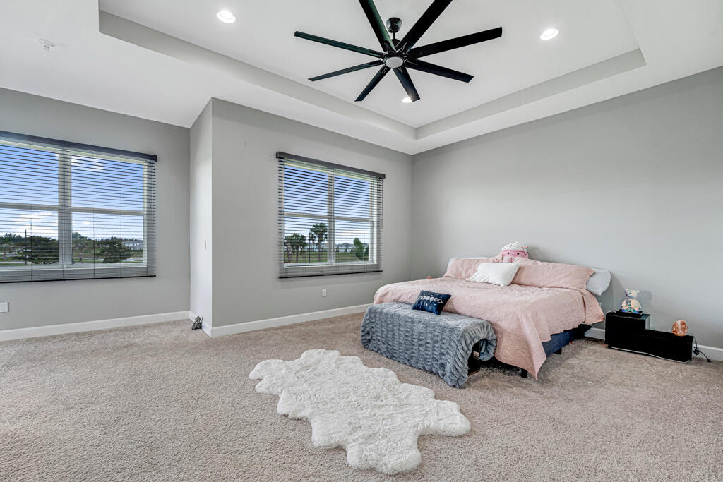 5482 Macoon Way Westlake, FL 33470 - Photo 11 of 69 a bedroom with bed and window