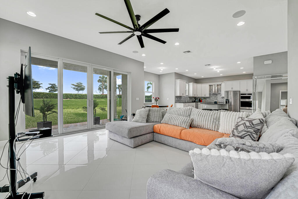 5482 Macoon Way Westlake, FL 33470 - Photo 17 of 69 a living room with furniture floor to ceiling window and floor to ceiling window