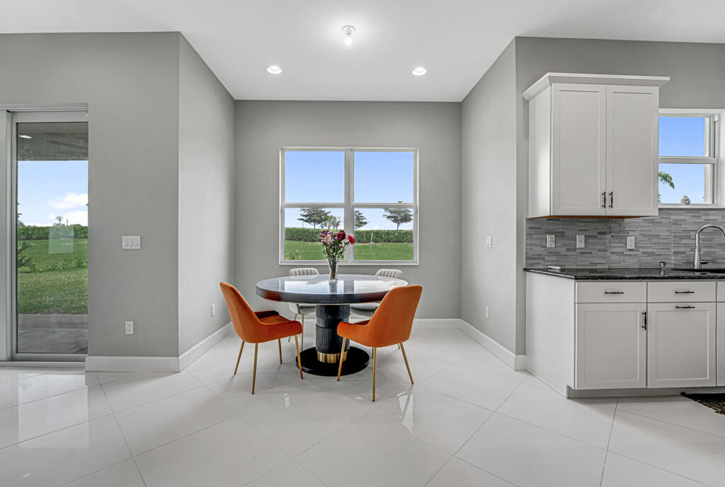 5482 Macoon Way Westlake, FL 33470 - Photo 19 of 69 a dining room with furniture and window