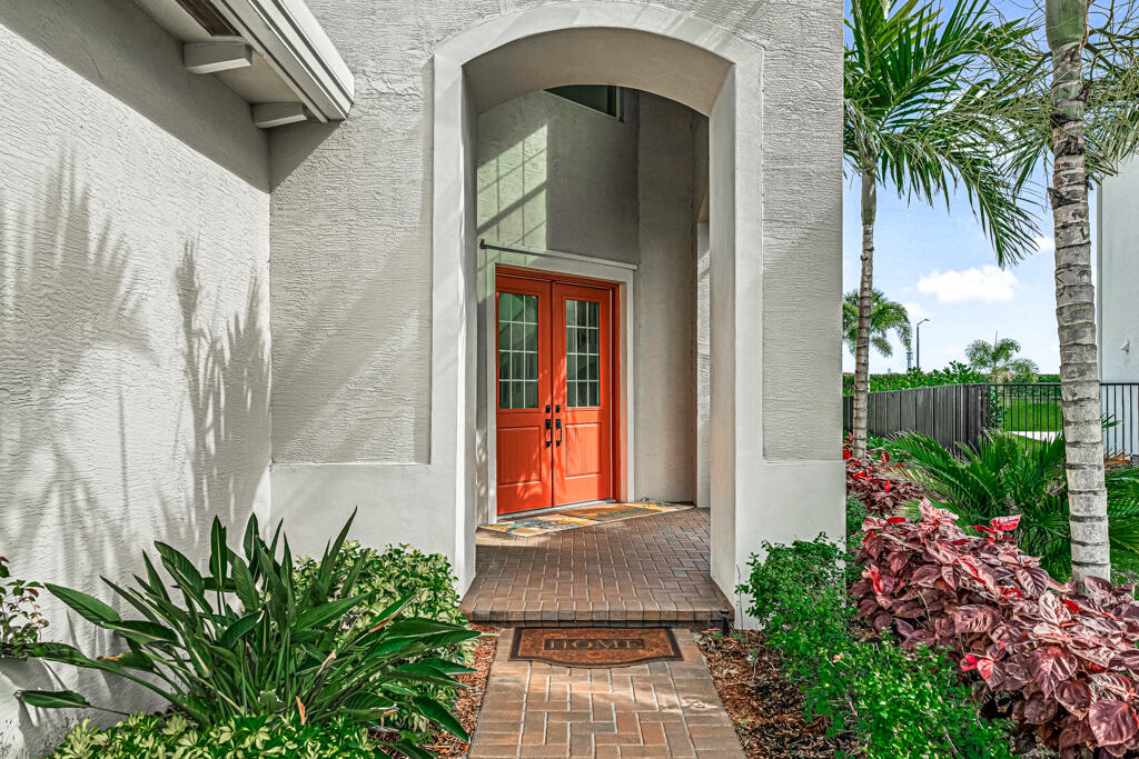 5482 Macoon Way Westlake, FL 33470 - Photo 2 of 69 a front view of a house with a yard