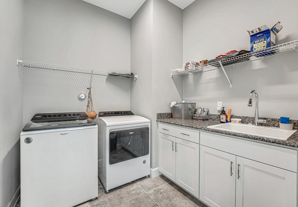 5482 Macoon Way Westlake, FL 33470 - Photo 24 of 69 a utility room with sink dryer and washer