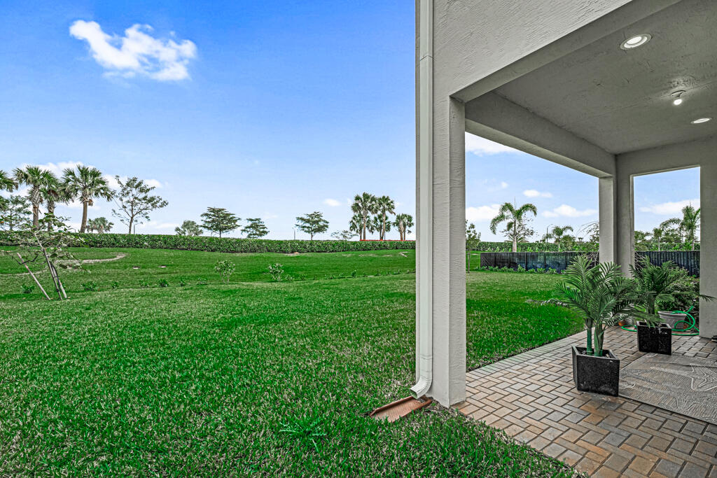 5482 Macoon Way Westlake, FL 33470 - Photo 28 of 69 a view of a porch with seating space