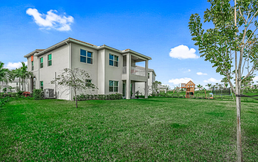 5482 Macoon Way Westlake, FL 33470 - Photo 44 of 69 a view of a house with backyard