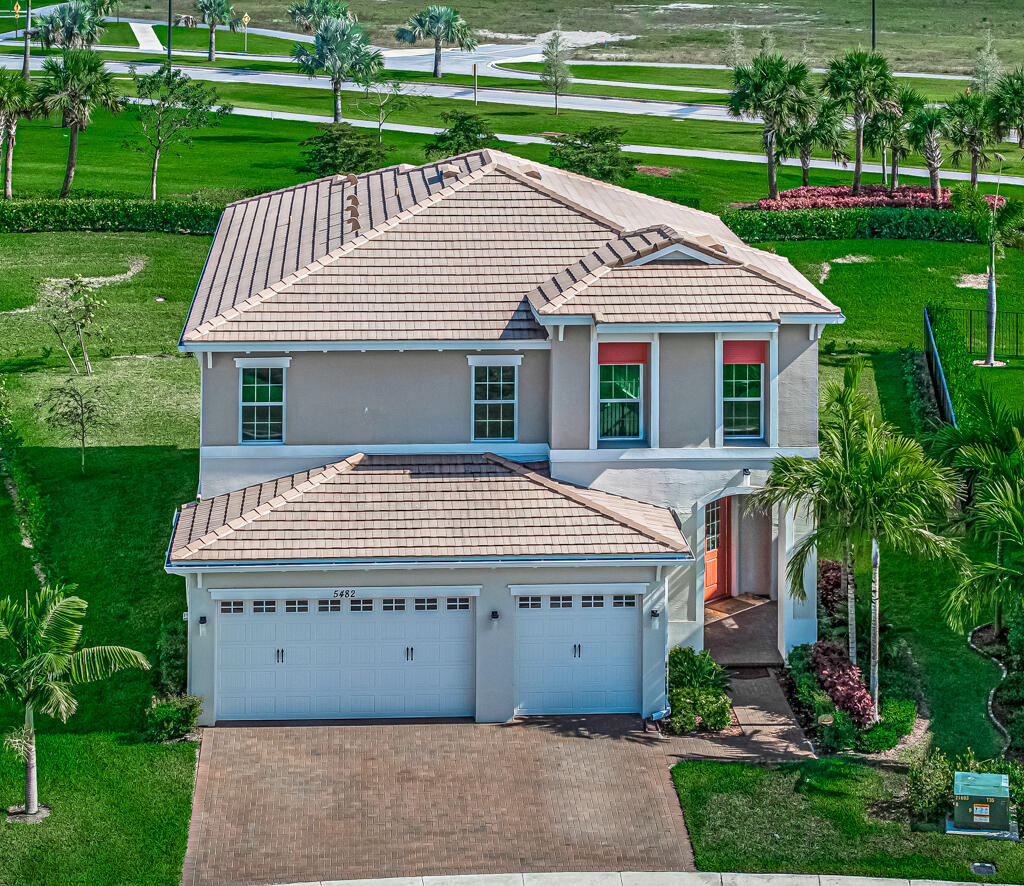 5482 Macoon Way Westlake, FL 33470 - Photo 45 of 69 a view of a house with a yard