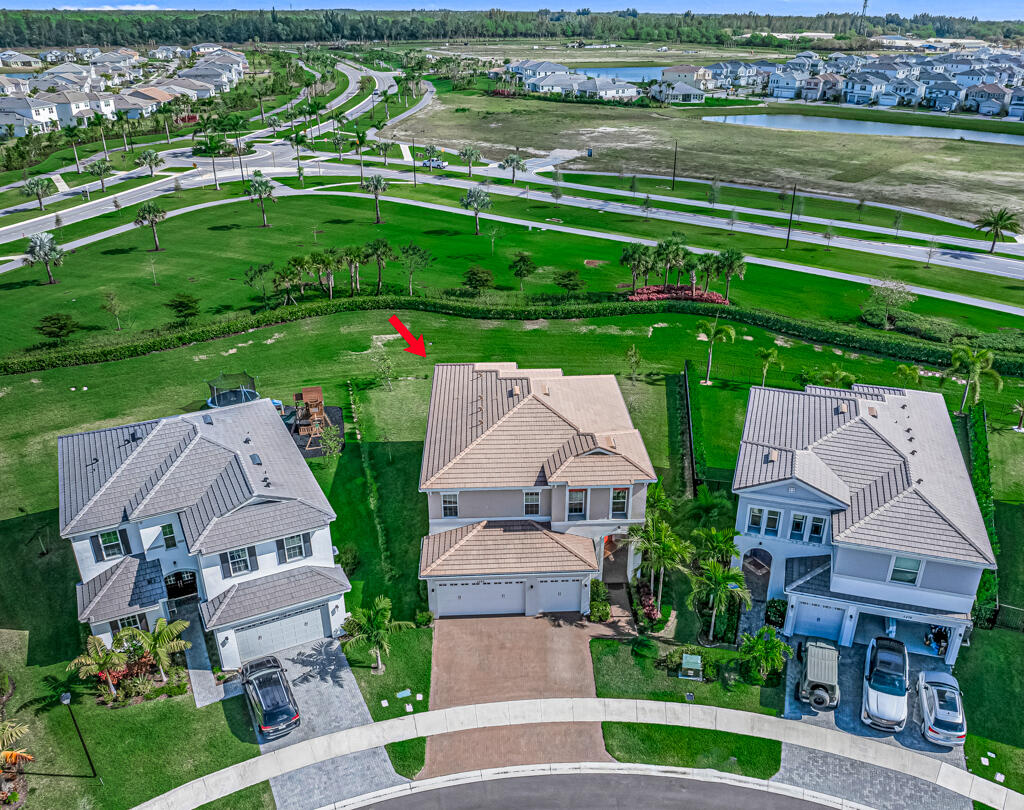 5482 Macoon Way Westlake, FL 33470 - Photo 47 of 69 an aerial view of multiple houses with yard