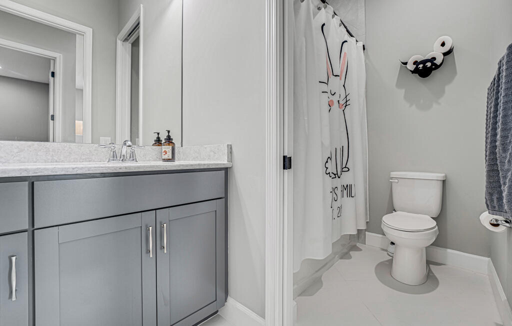 5482 Macoon Way Westlake, FL 33470 - Photo 60 of 69 a bathroom with a sink toilet and shower