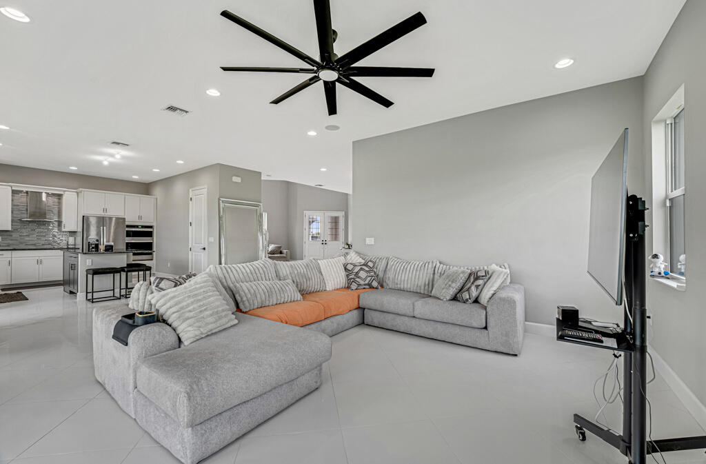5482 Macoon Way Westlake, FL 33470 - Photo 6 of 69 a living room with furniture and a view of kitchen