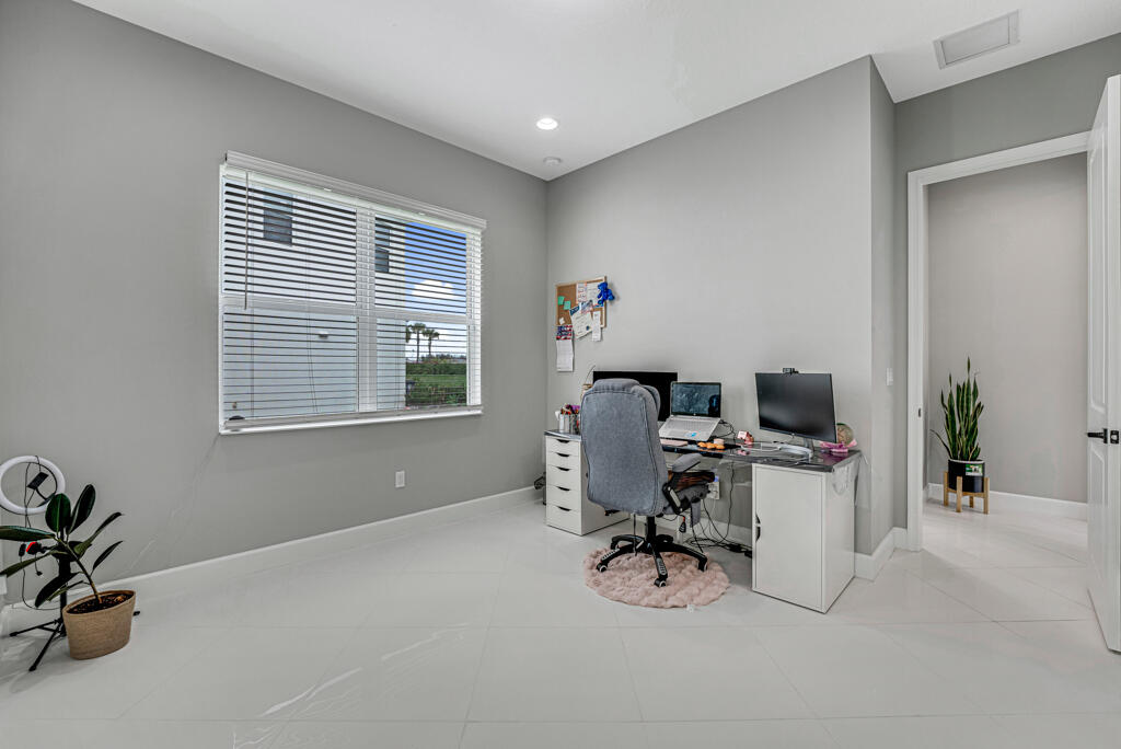 5482 Macoon Way Westlake, FL 33470 - Photo 61 of 69 a view of a workspace with furniture and a window