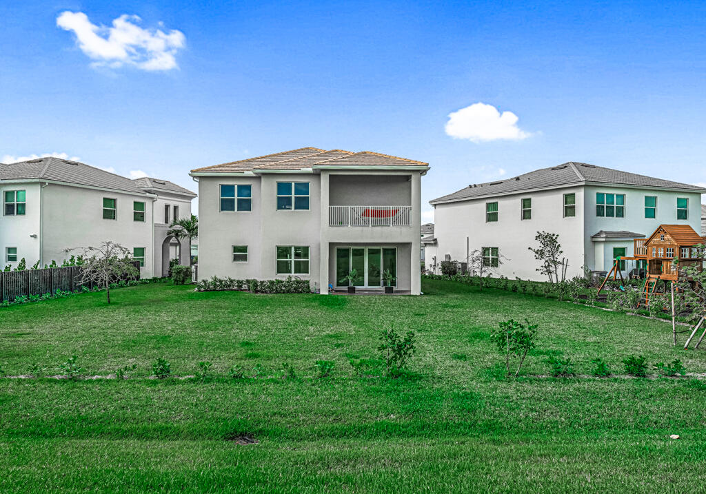 5482 Macoon Way Westlake, FL 33470 - Photo 63 of 69 a view of a house with backyard