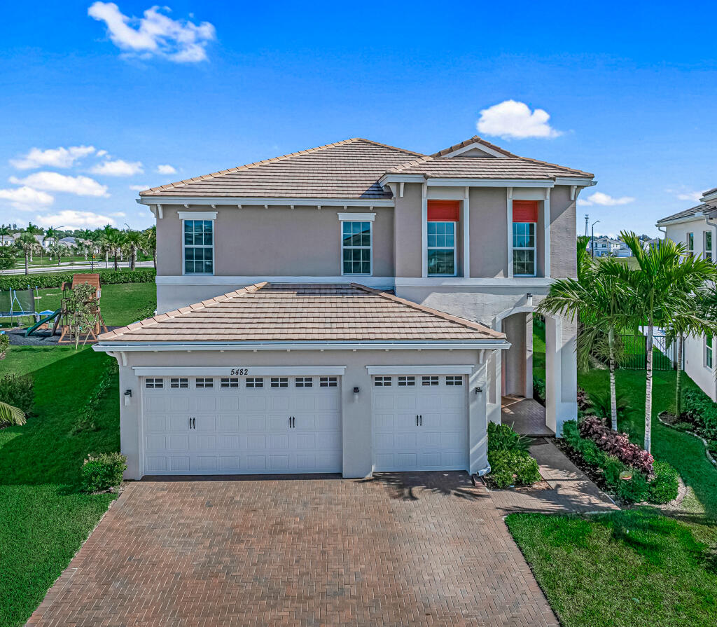 5482 Macoon Way Westlake, FL 33470 - Photo 64 of 69 a view of a house with a yard