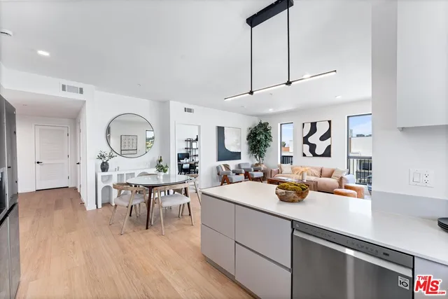 a view of a dining room kitchen with a table and chairs
