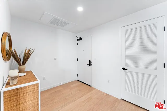 a view of a storage & utility room with a sink