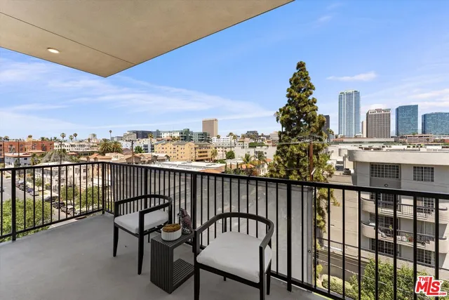 a view of a balcony with chairs