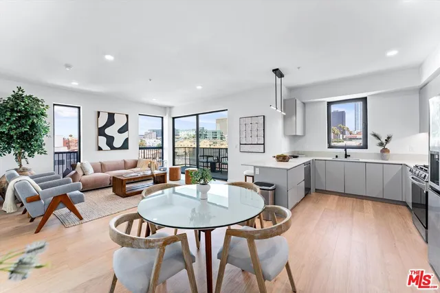 a living room with fireplace furniture and a wooden floor
