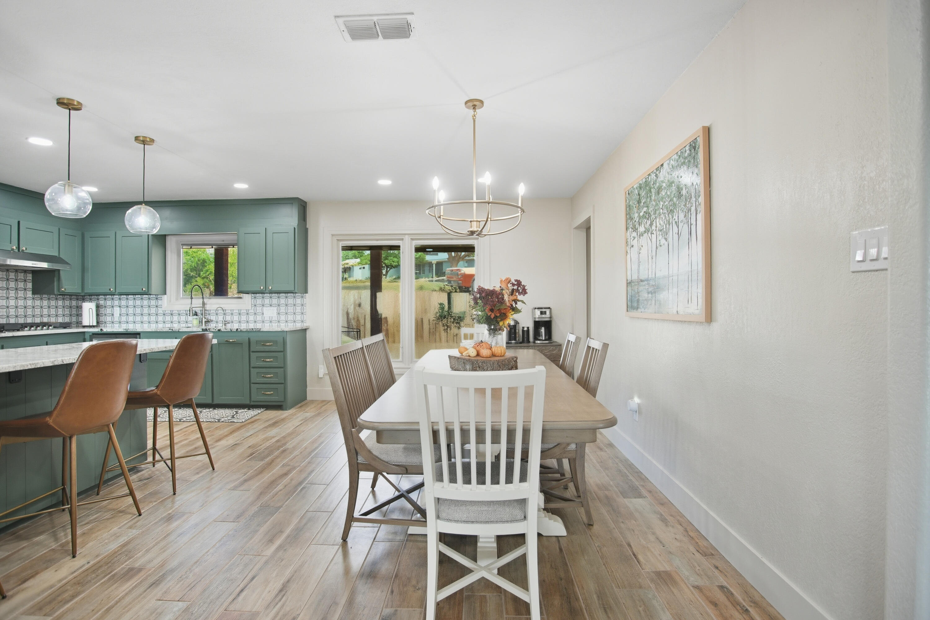25 East Canyonview Drive Ransom Canyon, TX 79366 - Photo 12 of 58 a view of a dining room with furniture and wooden floor