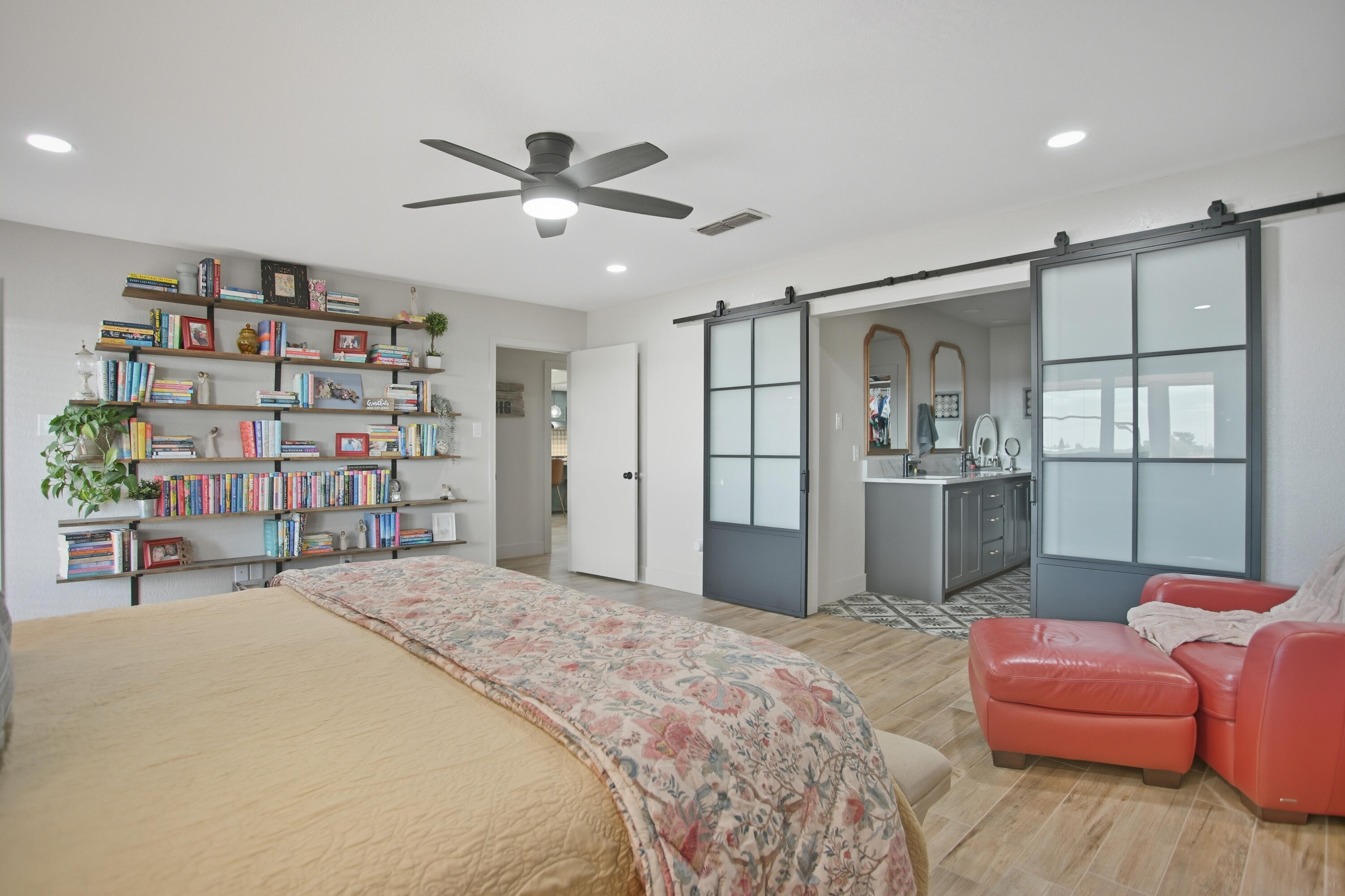 25 East Canyonview Drive Ransom Canyon, TX 79366 - Photo 32 of 58 a bedroom with a bed furniture and a book shelf