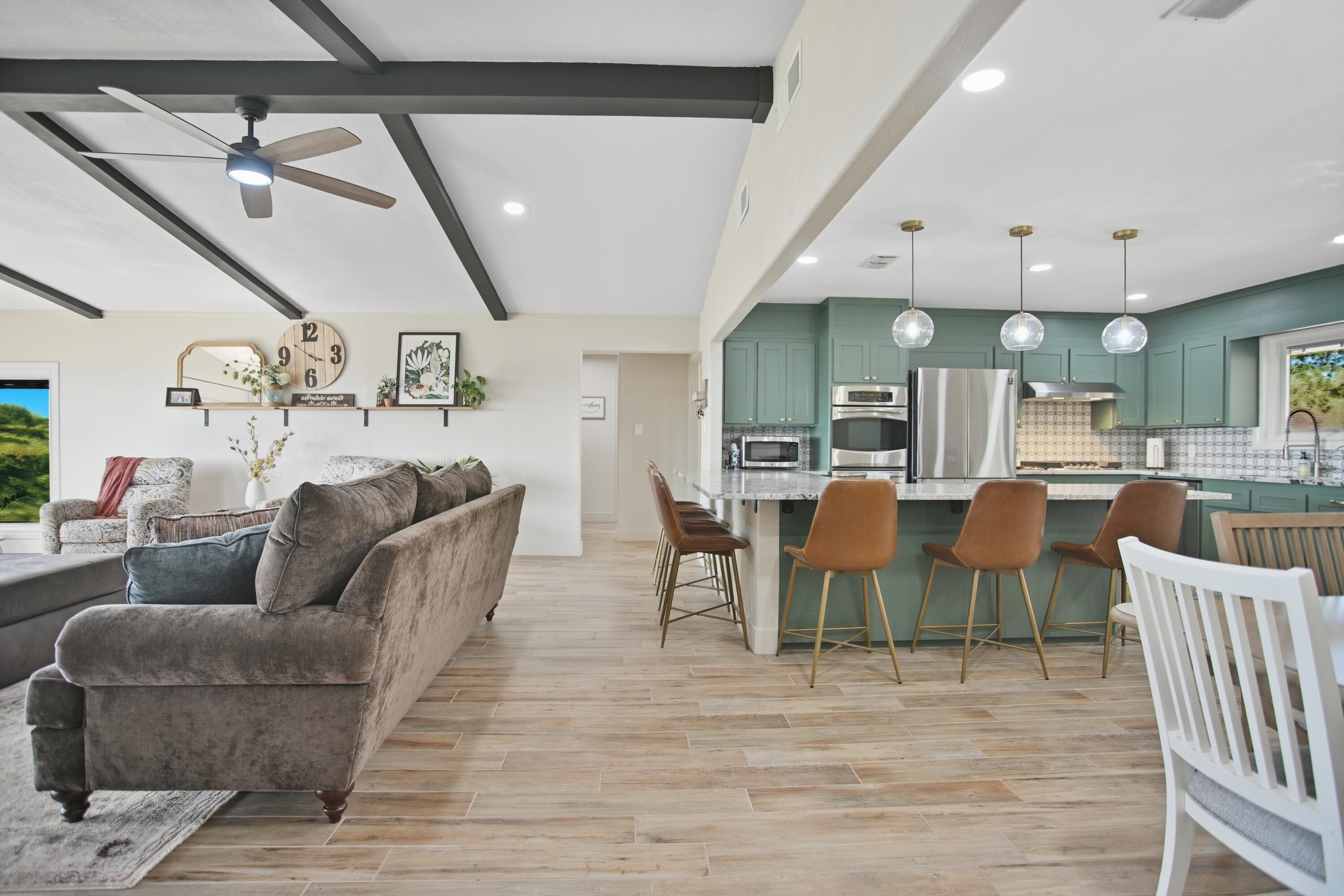 25 East Canyonview Drive Ransom Canyon, TX 79366 - Photo 34 of 58 a living room with lots of furniture and a wooden floor