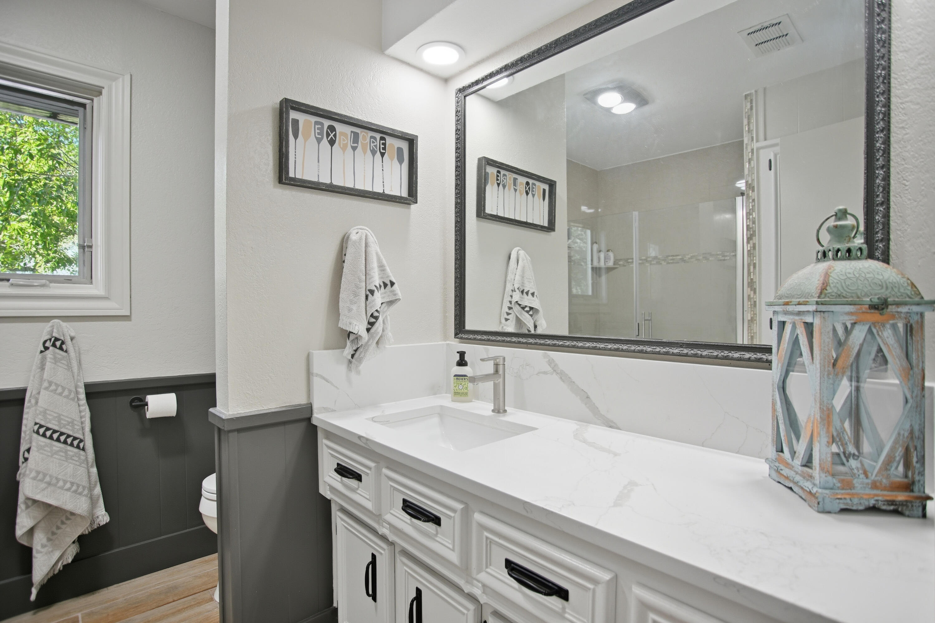 25 East Canyonview Drive Ransom Canyon, TX 79366 - Photo 40 of 58 a bathroom with a sink and a mirror
