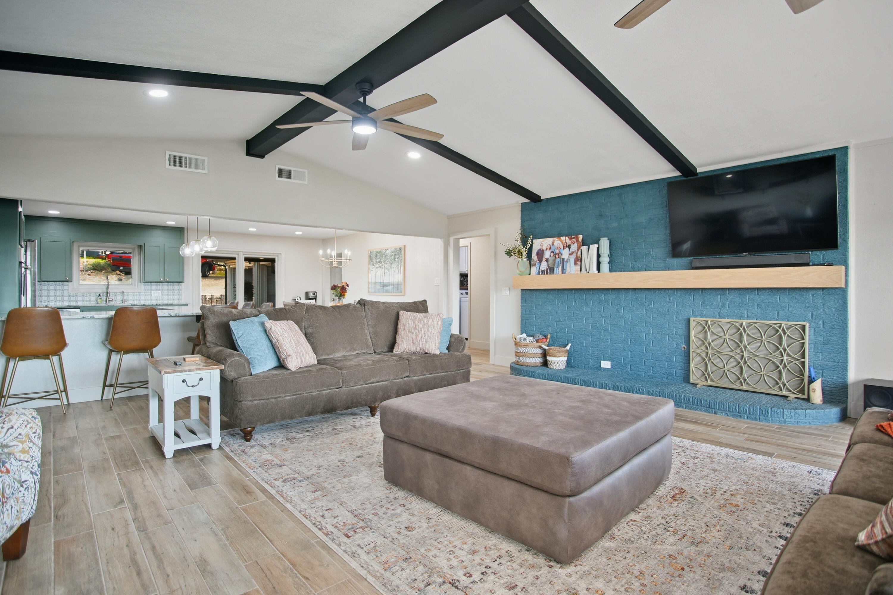25 East Canyonview Drive Ransom Canyon, TX 79366 - Photo 9 of 58 a living room with furniture and a flat screen tv