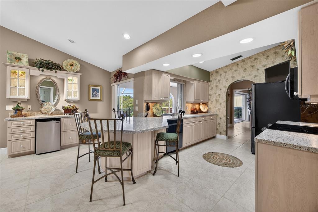 2855 Deborah Drive Punta Gorda, FL 33950 - Photo 11 of 41 a living room with furniture a dining table and kitchen view