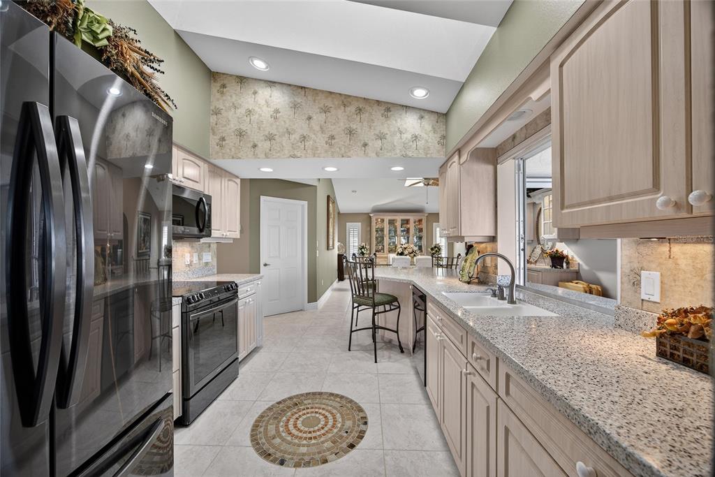 2855 Deborah Drive Punta Gorda, FL 33950 - Photo 12 of 41 a kitchen with stainless steel appliances granite countertop a sink stove and refrigerator