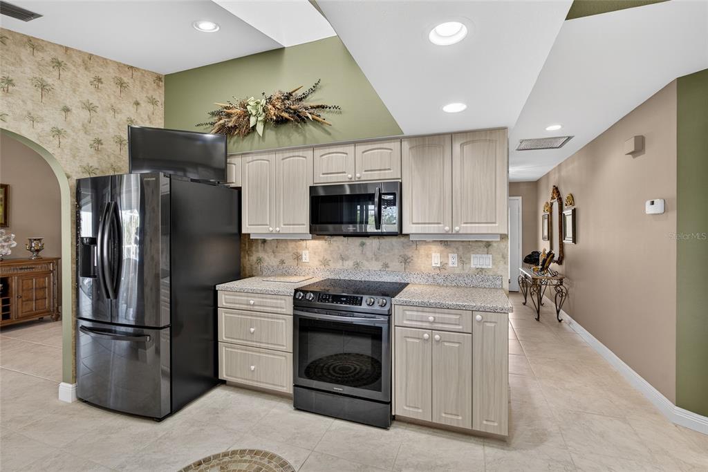 2855 Deborah Drive Punta Gorda, FL 33950 - Photo 13 of 41 a kitchen with stainless steel appliances granite countertop a refrigerator a stove and a sink