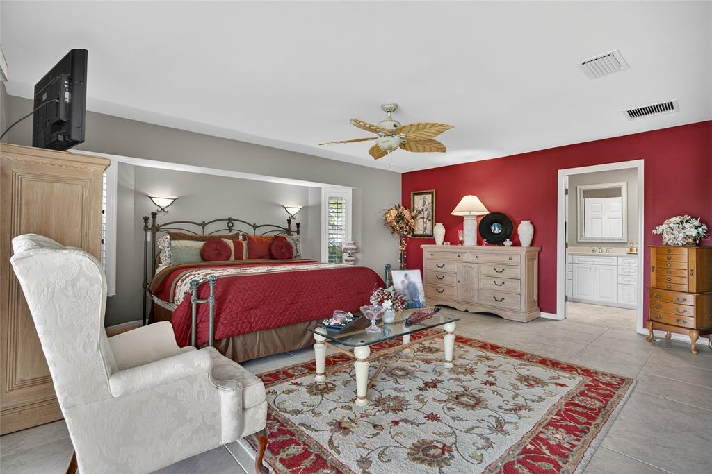 2855 Deborah Drive Punta Gorda, FL 33950 - Photo 15 of 41 a bedroom with a bed a rug and dresser