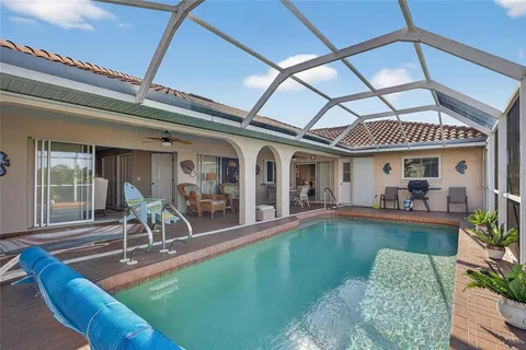 a view of a house with swimming pool in front of it