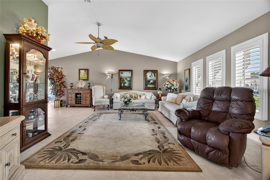 2855 Deborah Drive Punta Gorda, FL 33950 - Photo 5 of 41 a living room with furniture a large window and a chandelier