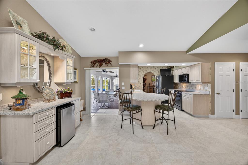 2855 Deborah Drive Punta Gorda, FL 33950 - Photo 10 of 41 a kitchen with a sink cabinets and dining table chair