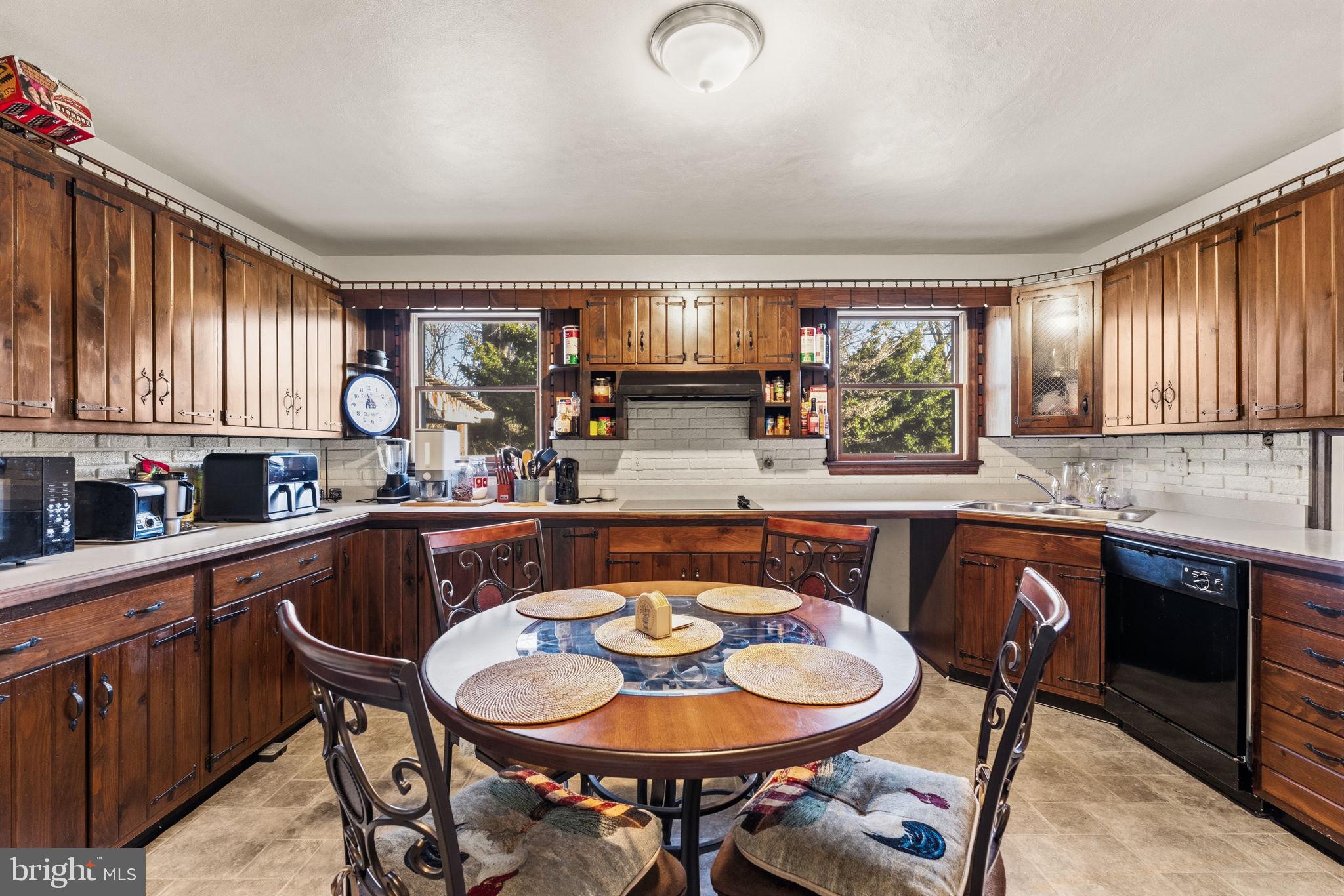 368 Appleton Road Elkton, MD 21921 - Photo 15 of 64 a large kitchen with a table and chairs in it