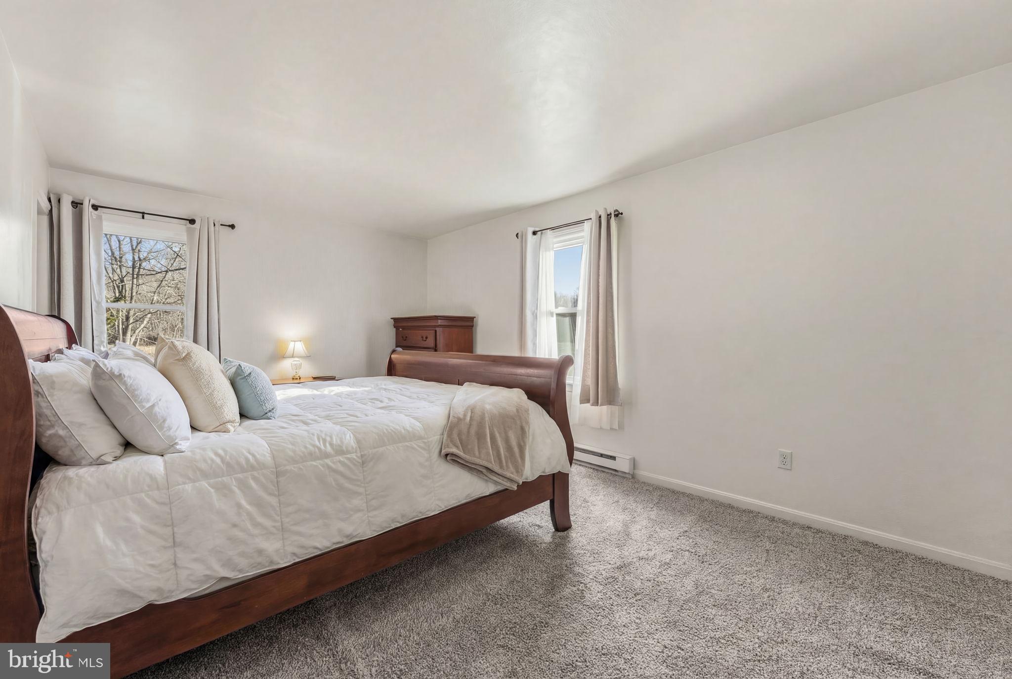 368 Appleton Road Elkton, MD 21921 - Photo 29 of 64 a bedroom with a bed and wooden floor