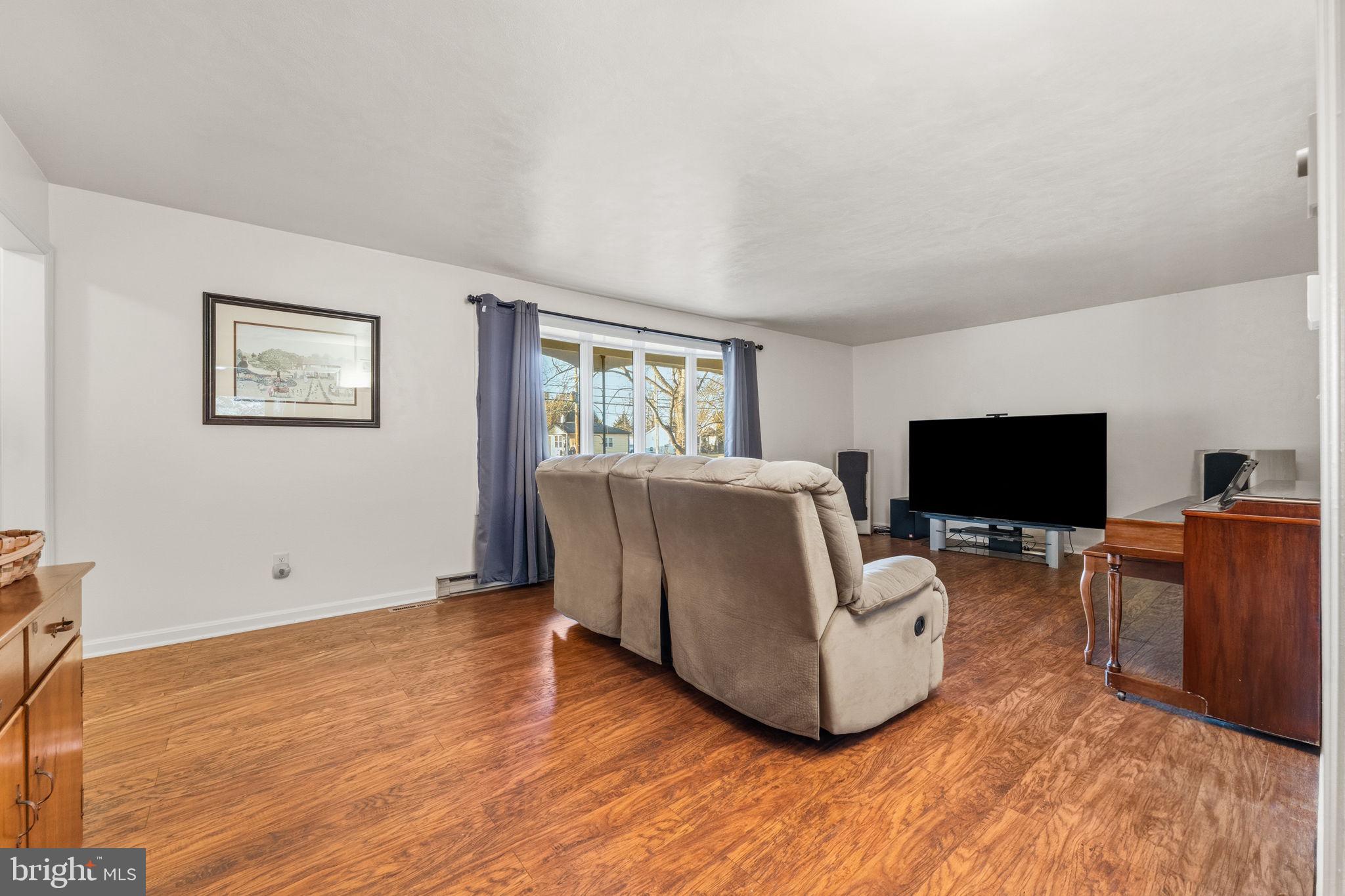 368 Appleton Road Elkton, MD 21921 - Photo 7 of 64 a living room with furniture and a flat screen tv