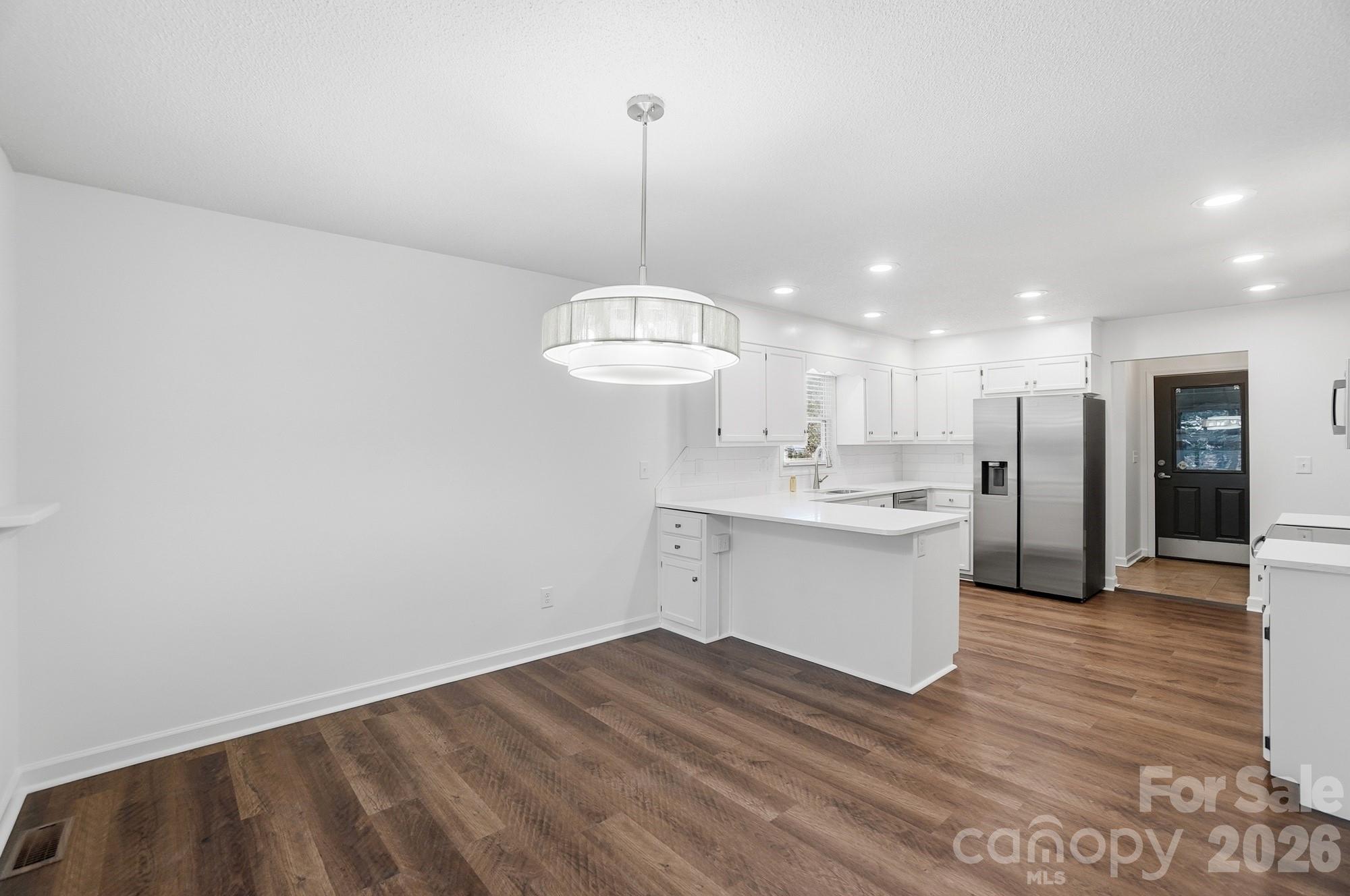 4437 Lake Shore Road North Denver, NC 28037 - Photo 12 of 43 a view of a kitchen with wooden floor and a sink