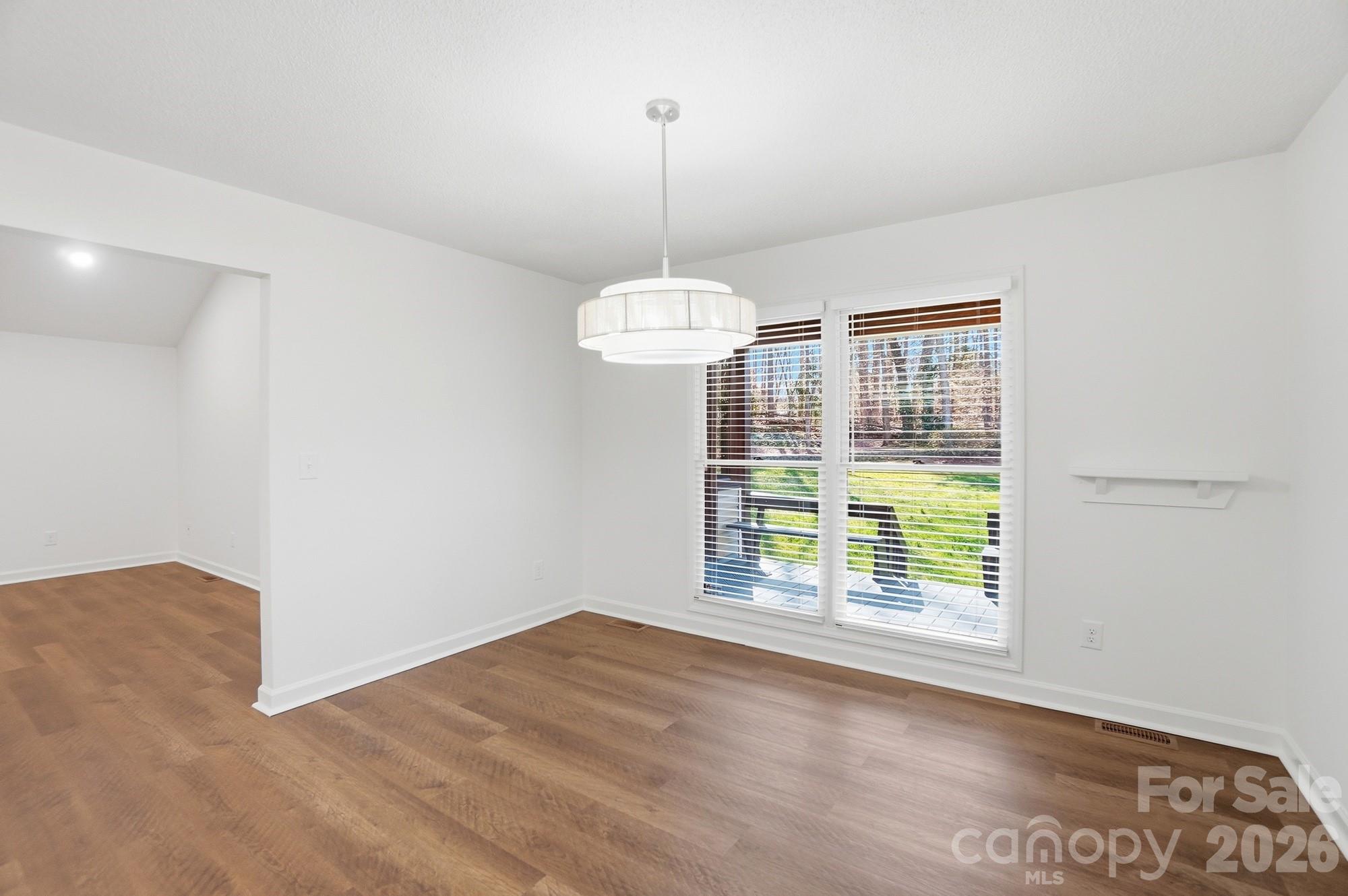 4437 Lake Shore Road North Denver, NC 28037 - Photo 16 of 43 a view of an empty room with a window
