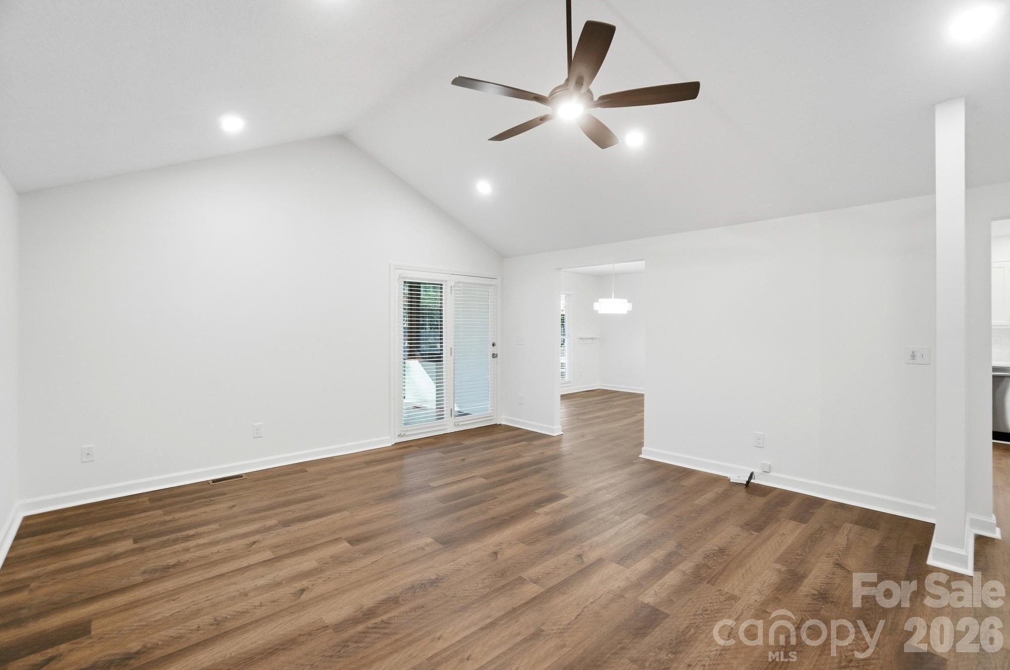 4437 Lake Shore Road North Denver, NC 28037 - Photo 17 of 43 an empty room with wooden floor and windows