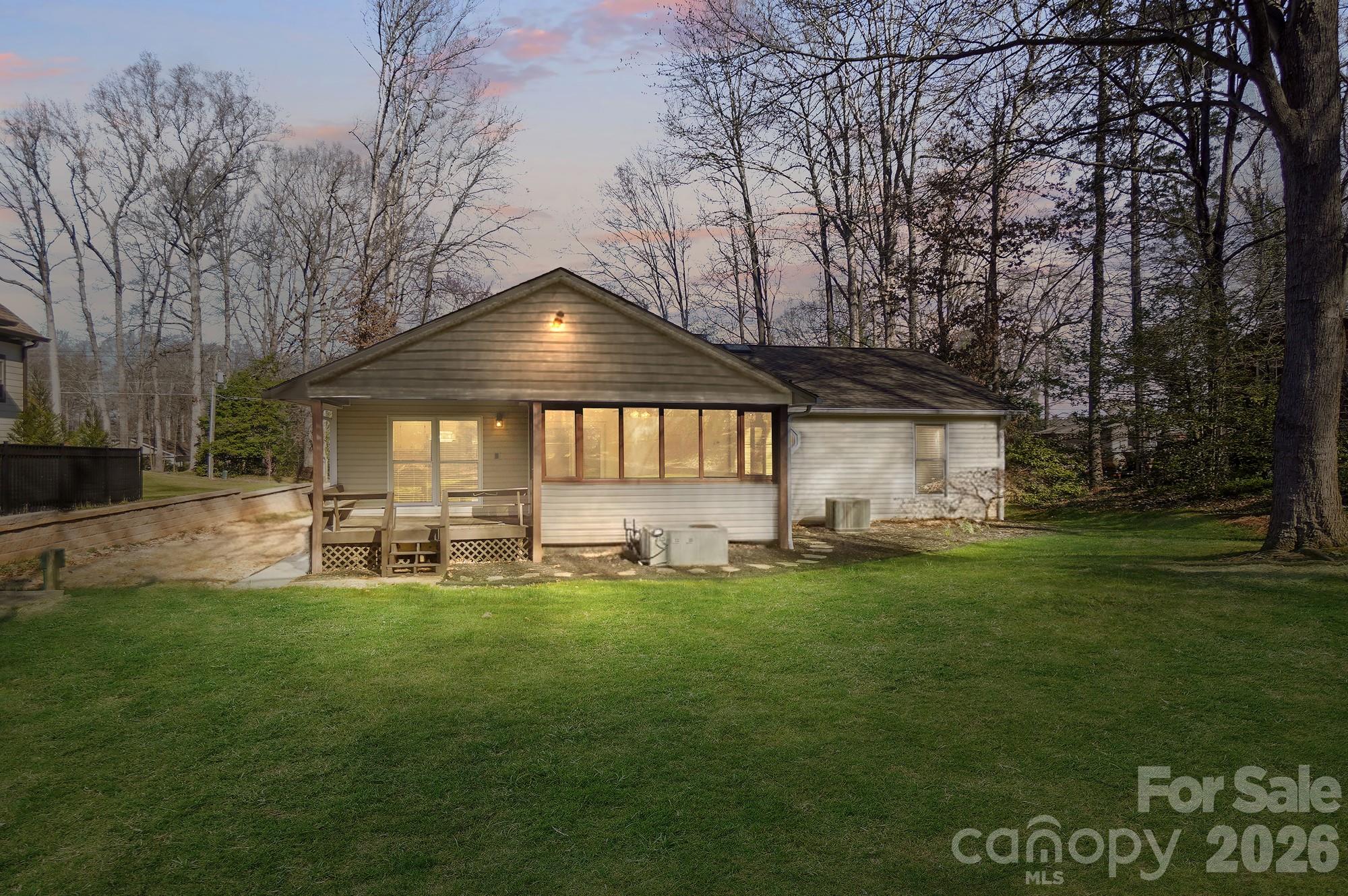 4437 Lake Shore Road North Denver, NC 28037 - Photo 2 of 43 a view of a house with a yard and sitting area