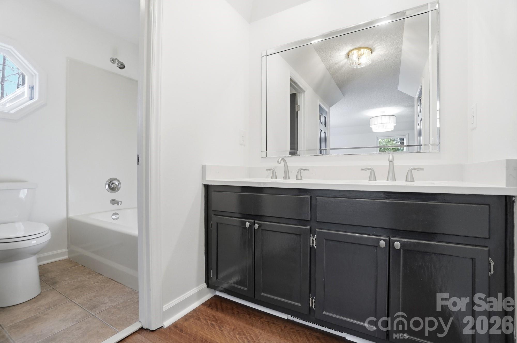 4437 Lake Shore Road North Denver, NC 28037 - Photo 21 of 43 a bathroom with a sink toilet and shower