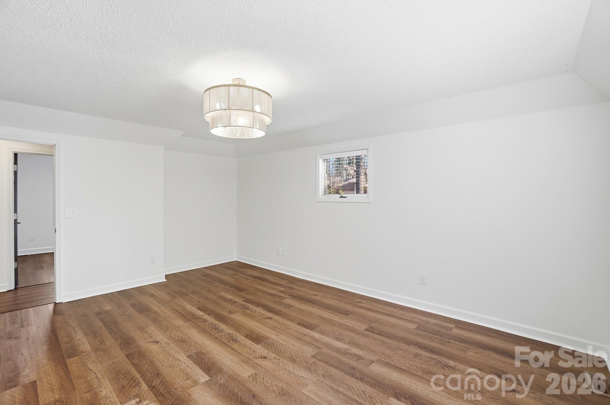 4437 Lake Shore Road North Denver, NC 28037 - Photo 22 of 43 a view of empty room with wooden floor