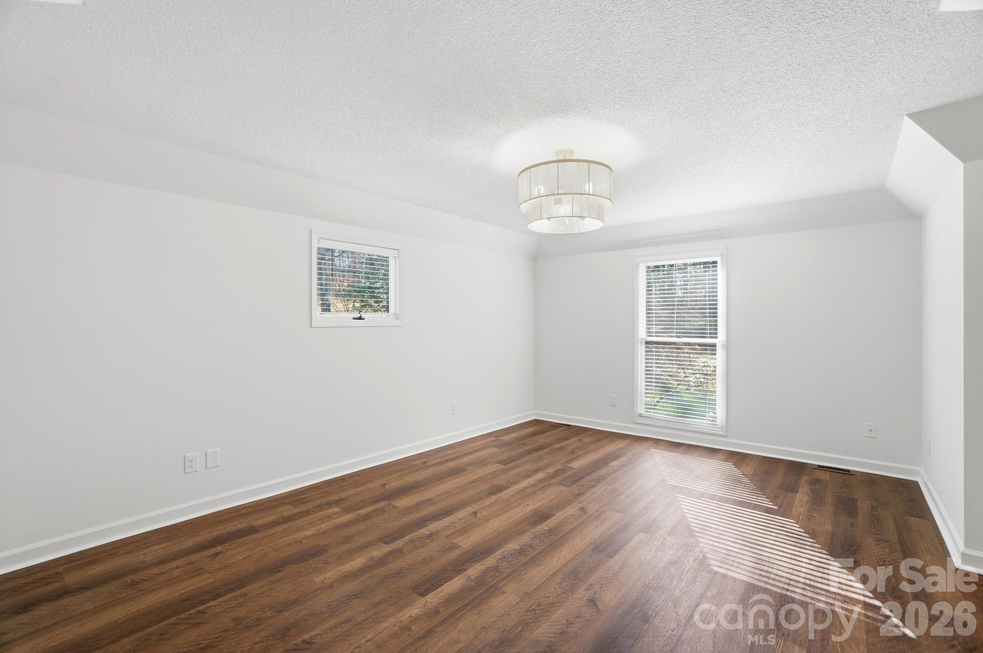 4437 Lake Shore Road North Denver, NC 28037 - Photo 24 of 43 wooden floor in an empty room with a window
