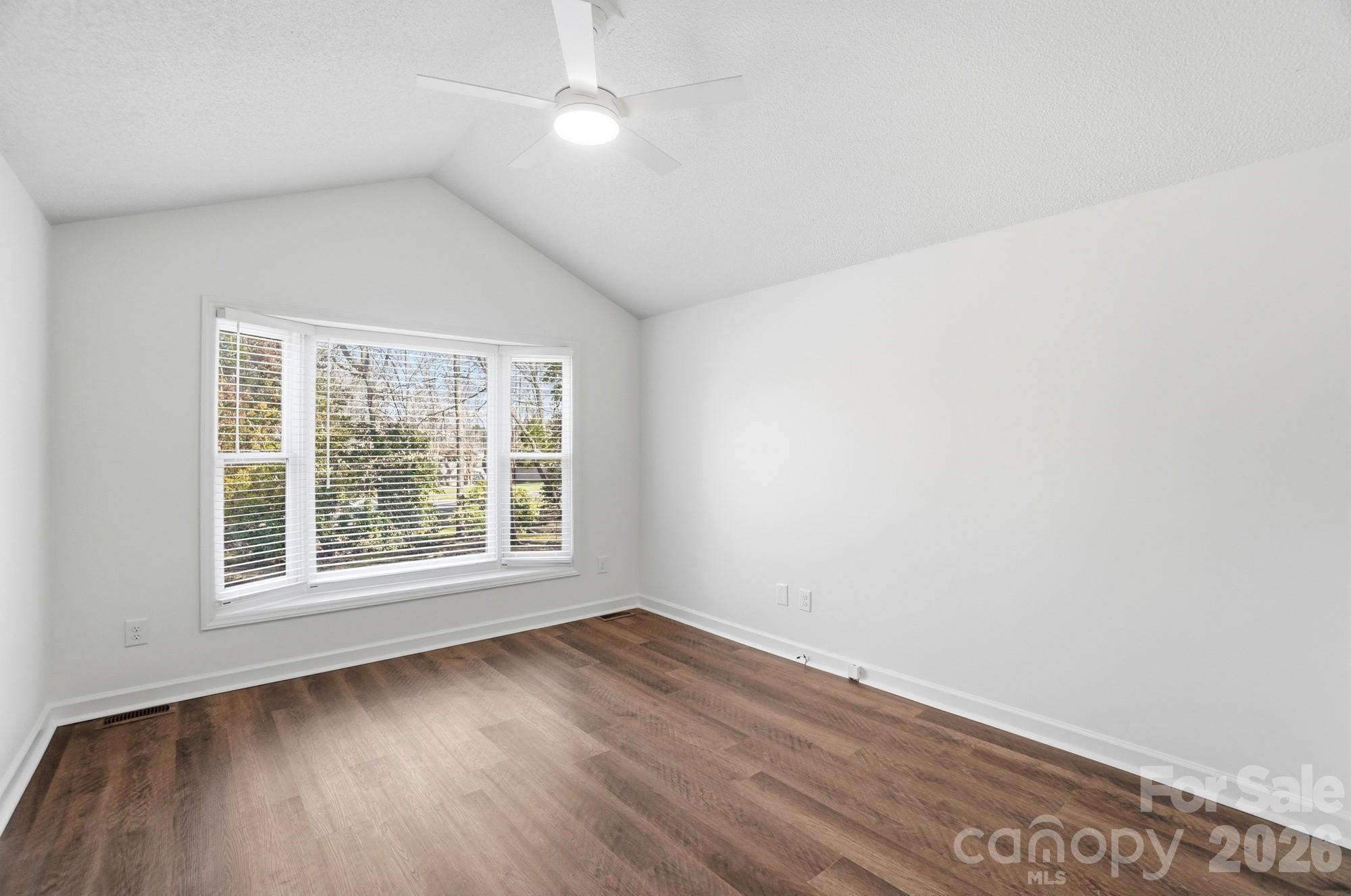 4437 Lake Shore Road North Denver, NC 28037 - Photo 27 of 43 an empty room with wooden floor and windows