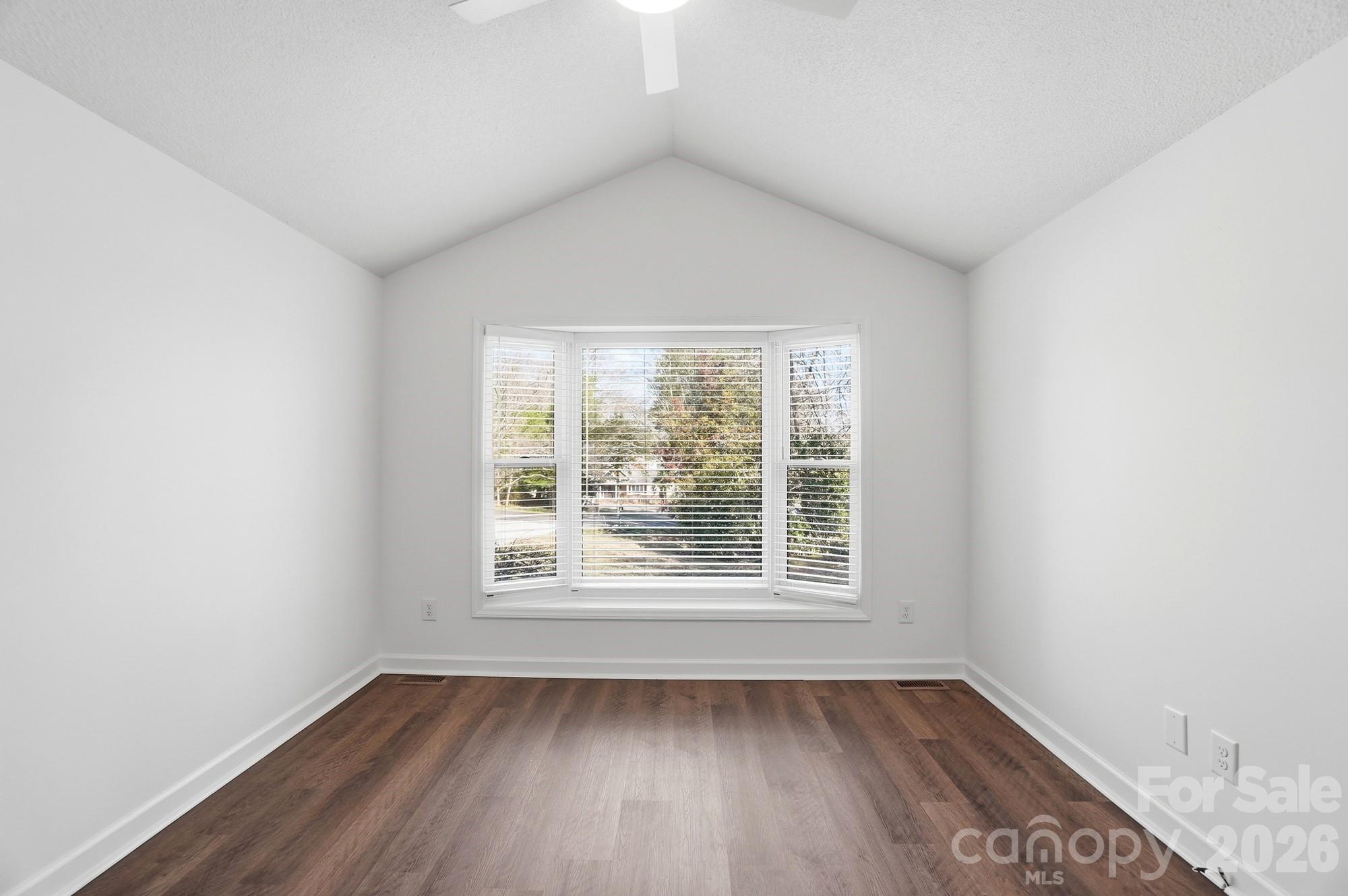 4437 Lake Shore Road North Denver, NC 28037 - Photo 30 of 43 an empty room with wooden floor and windows