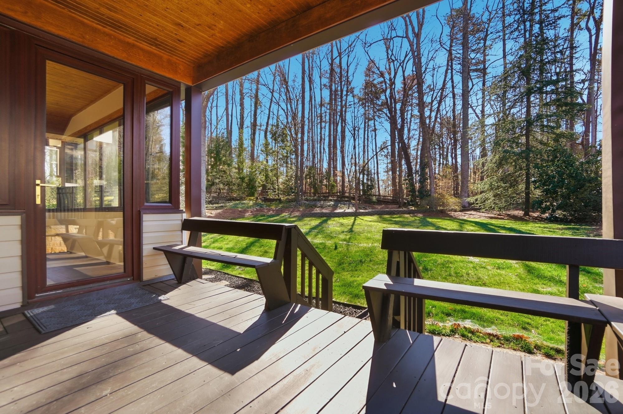 4437 Lake Shore Road North Denver, NC 28037 - Photo 35 of 43 a wooden bench sitting in front of a building