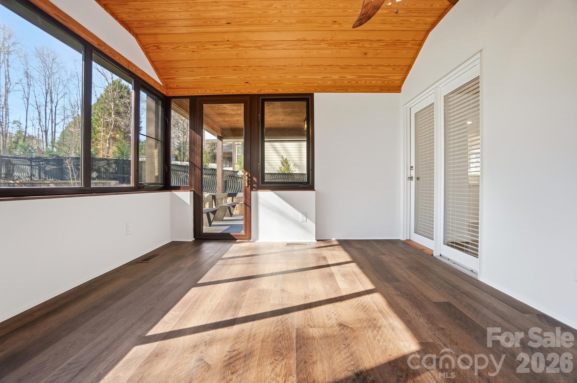4437 Lake Shore Road North Denver, NC 28037 - Photo 37 of 43 a view of an empty room with wooden floor and a window
