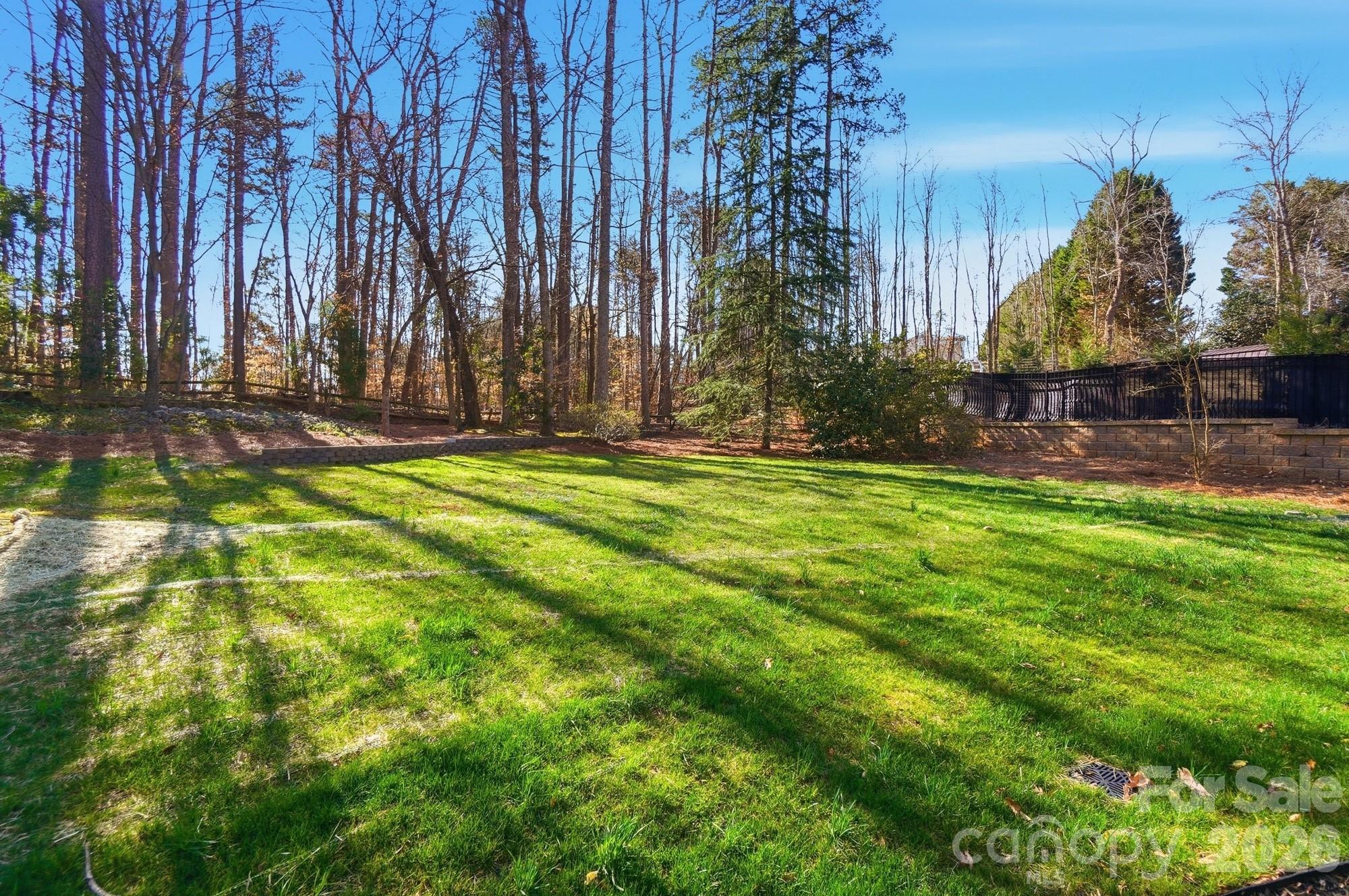 4437 Lake Shore Road North Denver, NC 28037 - Photo 43 of 43 a swimming pool with outdoor seating and yard