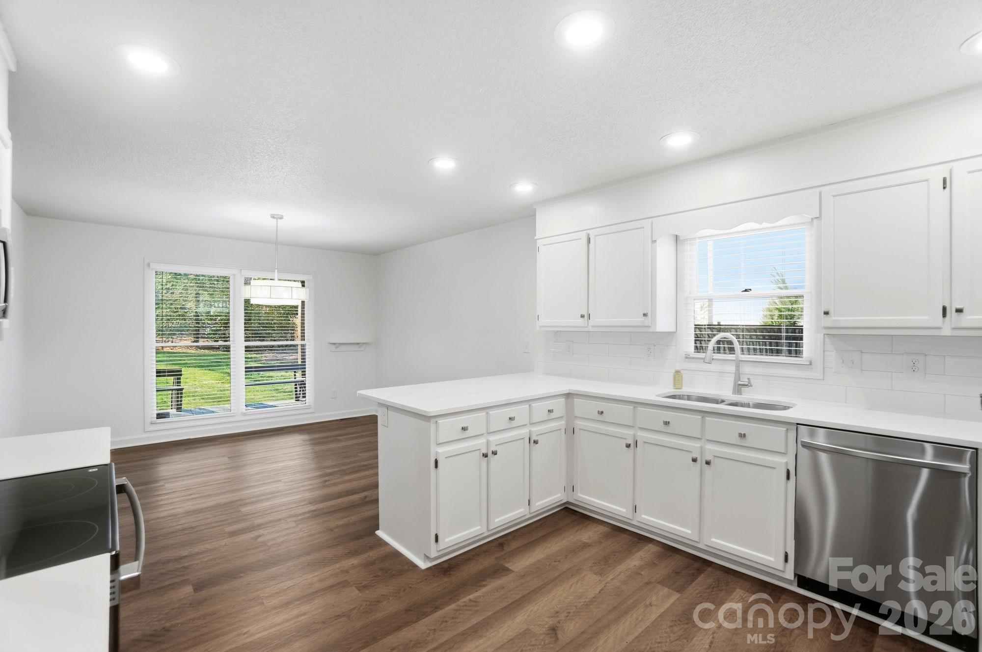 4437 Lake Shore Road North Denver, NC 28037 - Photo 9 of 43 a kitchen with a sink window and cabinets