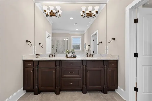 a spacious bathroom with a double vanity sink and a mirror