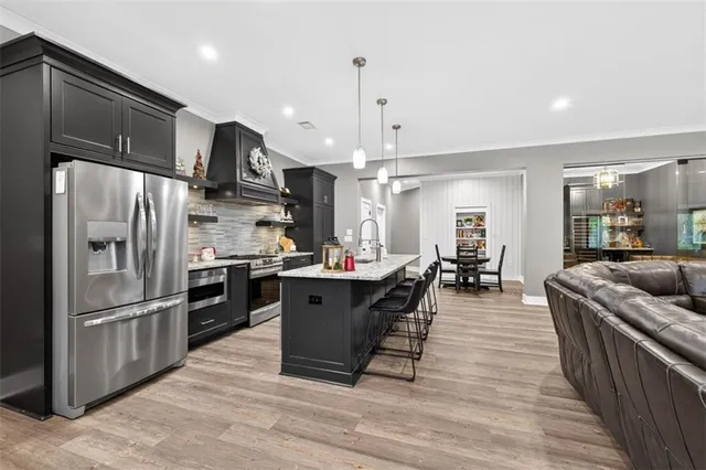 a living room with furniture and flat screen tv