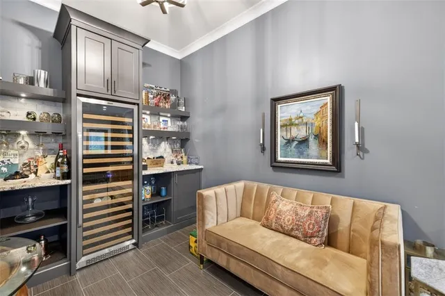 a bathroom with a granite countertop toilet sink and mirror