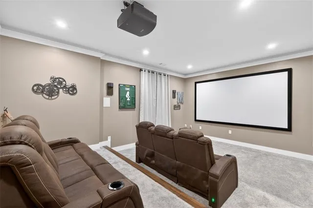 a living room with a bed furniture and a flat screen tv